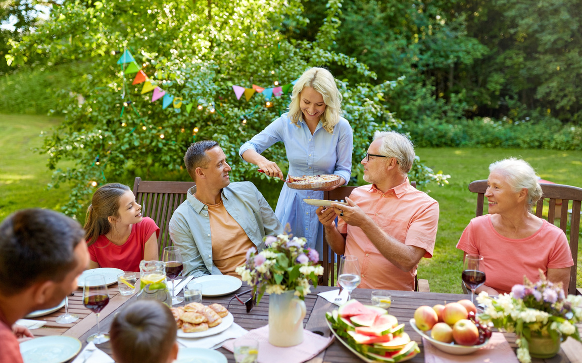 Happy Family Having Dinner or Summer Garden Party
